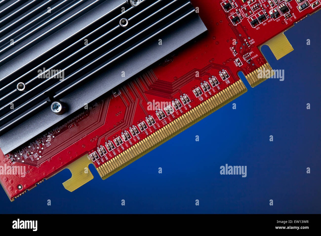 PCI-Express graphics card: detail of gold contacts and heatsink Stock Photo