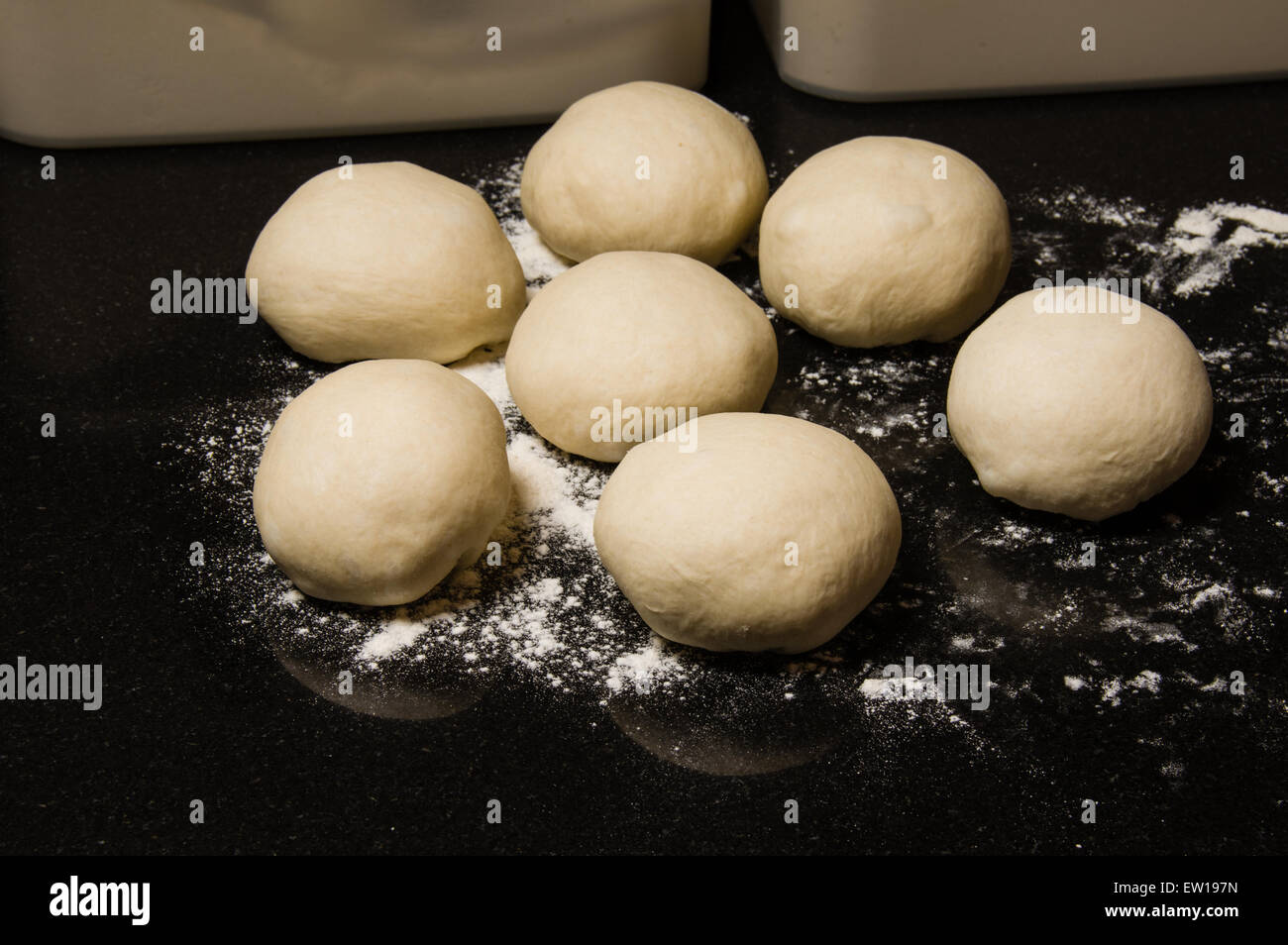 Dough balls rising to make rolls or bagels Stock Photo