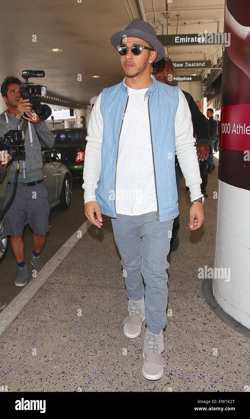 Lewis Hamilton, wearing a pair of Kanye West x Adidas Yeezy 750 arrives at Los Angeles International Airport (LAX) on a flight from London Featuring: Lewis Hamilton Where: Los California,
