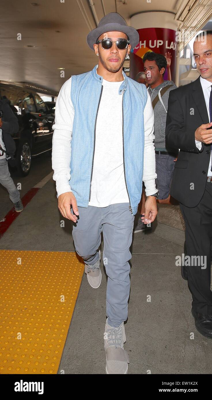 Lewis Hamilton, wearing a pair of Kanye West x Adidas Yeezy 750 Boost,  arrives at Los Angeles International Airport (LAX) on a flight from London  Featuring: Lewis Hamilton Where: Los Angeles, California,