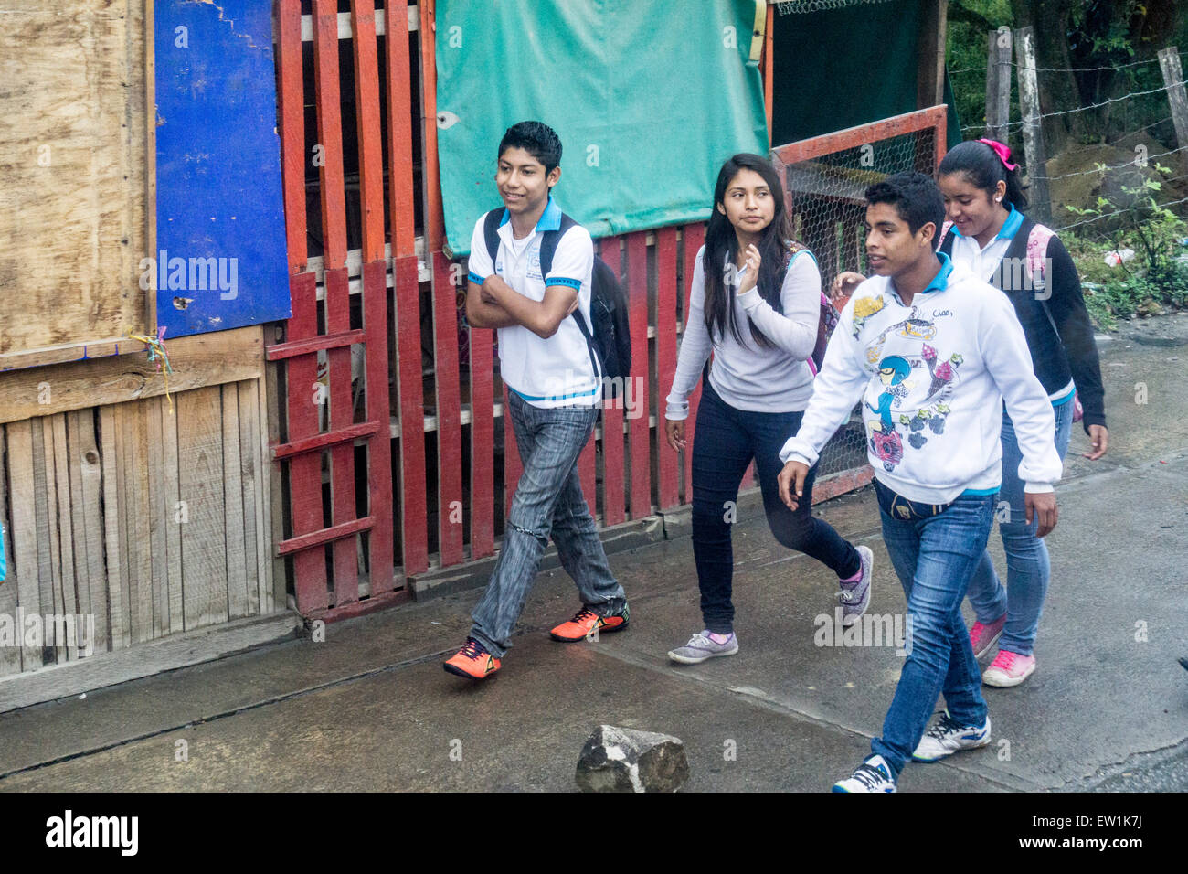 Mexican high school kids wearing school jerseys with distinctive blue collars walk home from