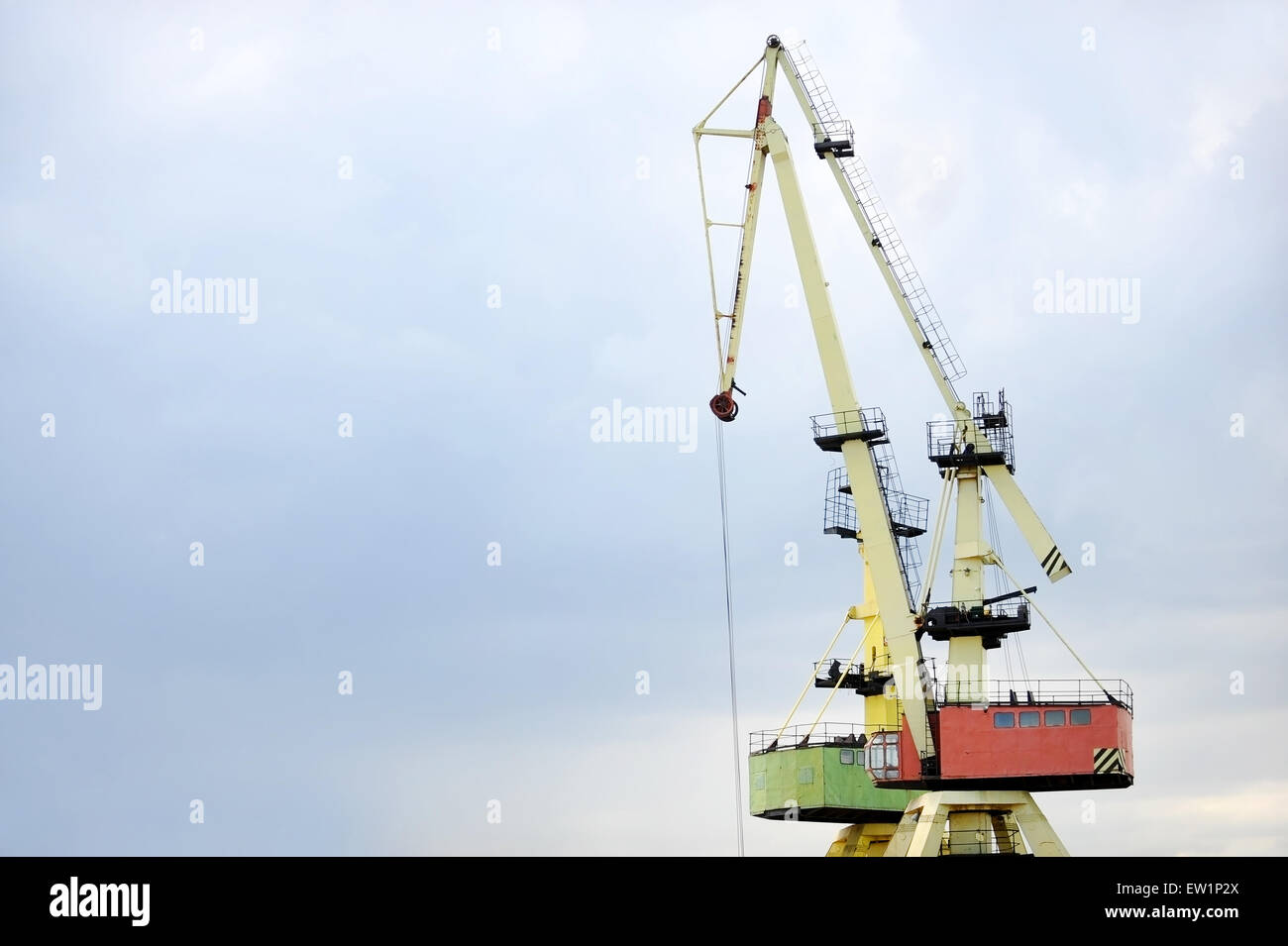 Industrial shipping cranes for containers in a port Stock Photo