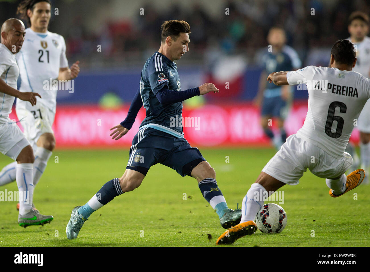 La Serena, Chile. 16th June, 2015. Lionel Messi (C) of Argentina vies for the ball with Alvaro Pereira of Uruguay during the Group B match at the 2015 American Cup, at La Portada stadium, in La Serena, Chile, on June 16, 2015. Argentina won 1-0. Credit:  Luis Echeverria/Xinhua/Alamy Live News Stock Photo