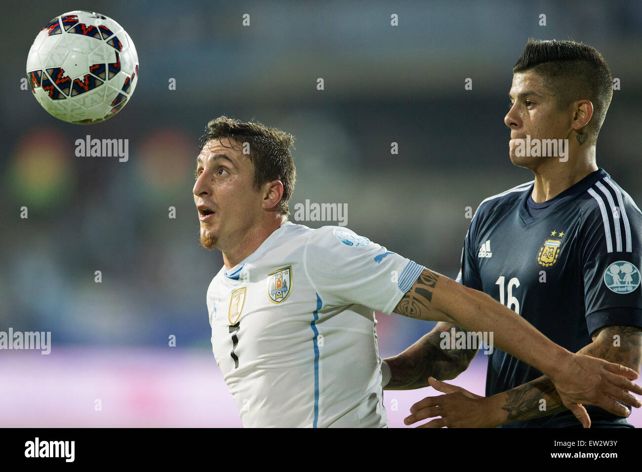 La Serena, Chile. 16th June, 2015. Marcos Rojo (R) of Argentina vies for the ball with Cristian Rodriguez of Uruguay during the Group B match at the 2015 American Cup, at La Portada stadium, in La Serena, Chile, on June 16, 2015. Argentina won 1-0. Credit:  Luis Echeverria/Xinhua/Alamy Live News Stock Photo