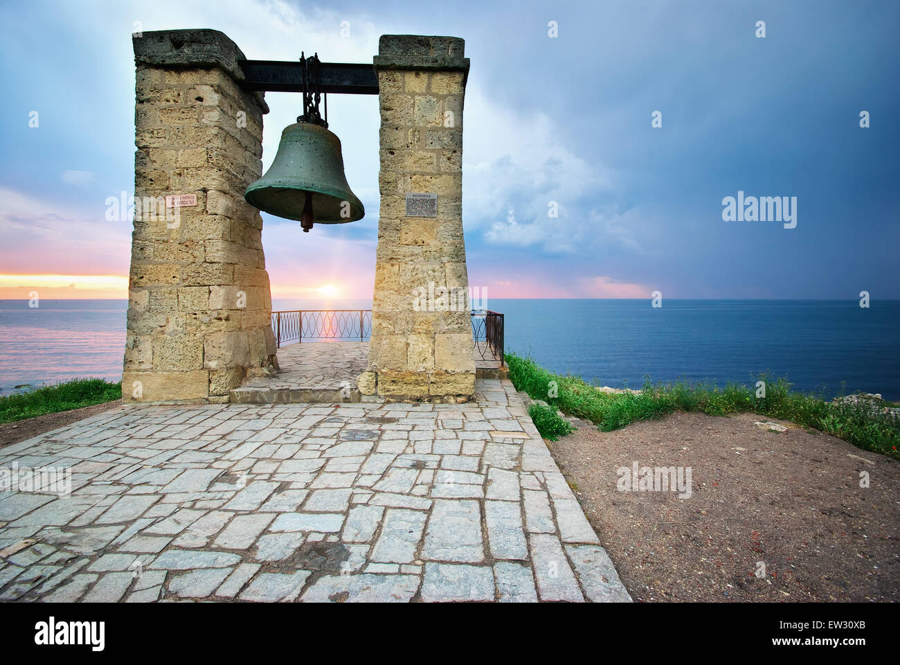 Big bell on sea shore. Nature composition. Stock Photo