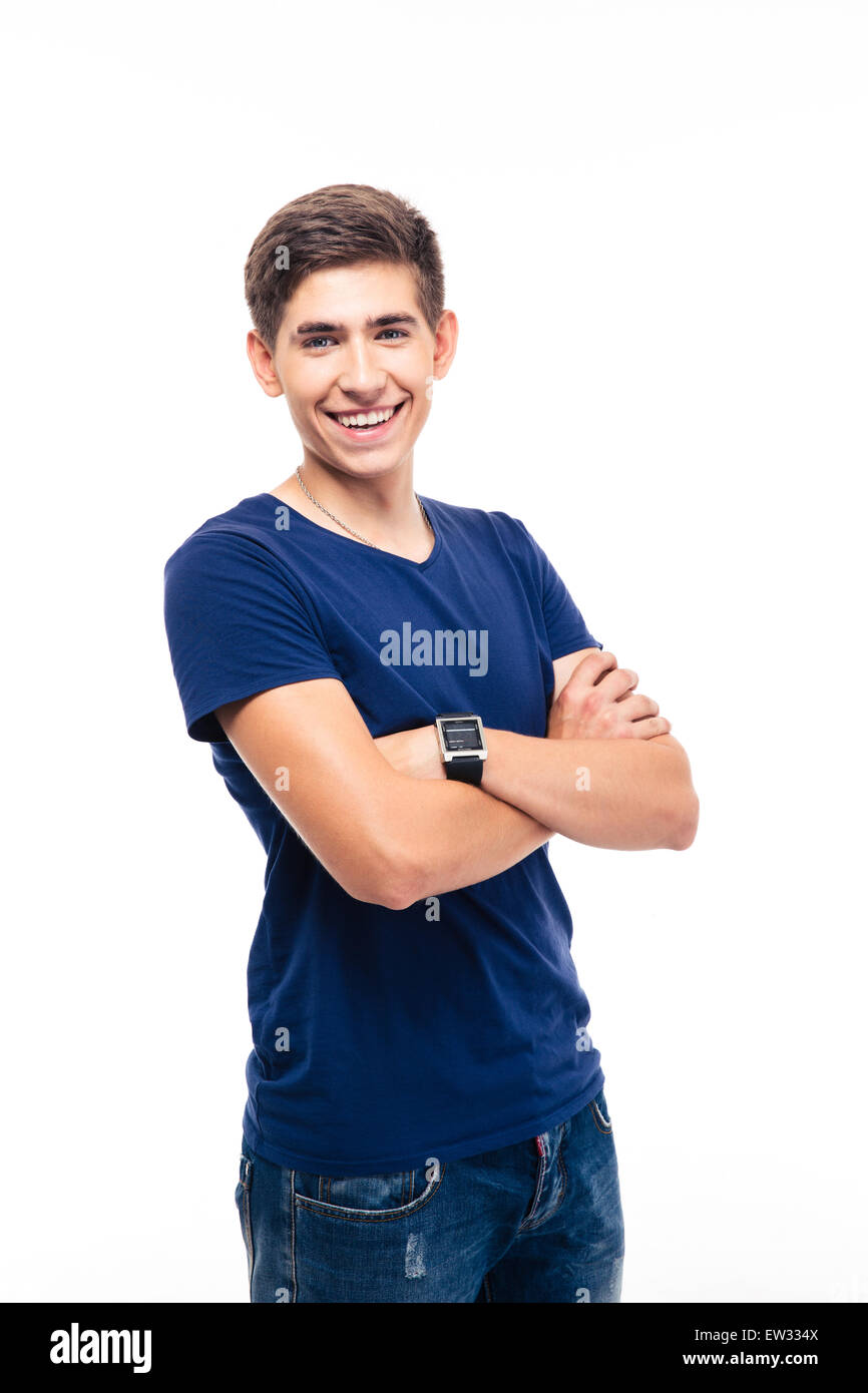 Portrait of a smiling young casual man standing with arms folded ...