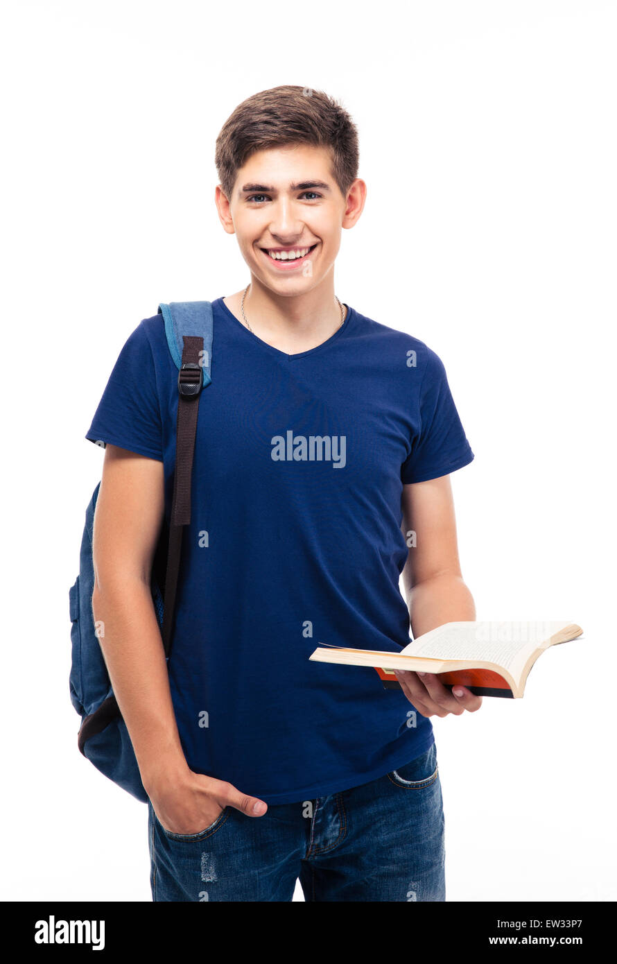 Smiling male student standing and holding book isolated on a white ...