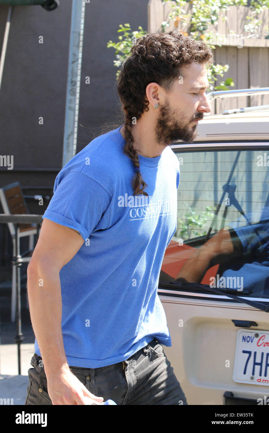 Shia Labeouf Sporting A Long Ponytail And A Silver Love Heart Ear