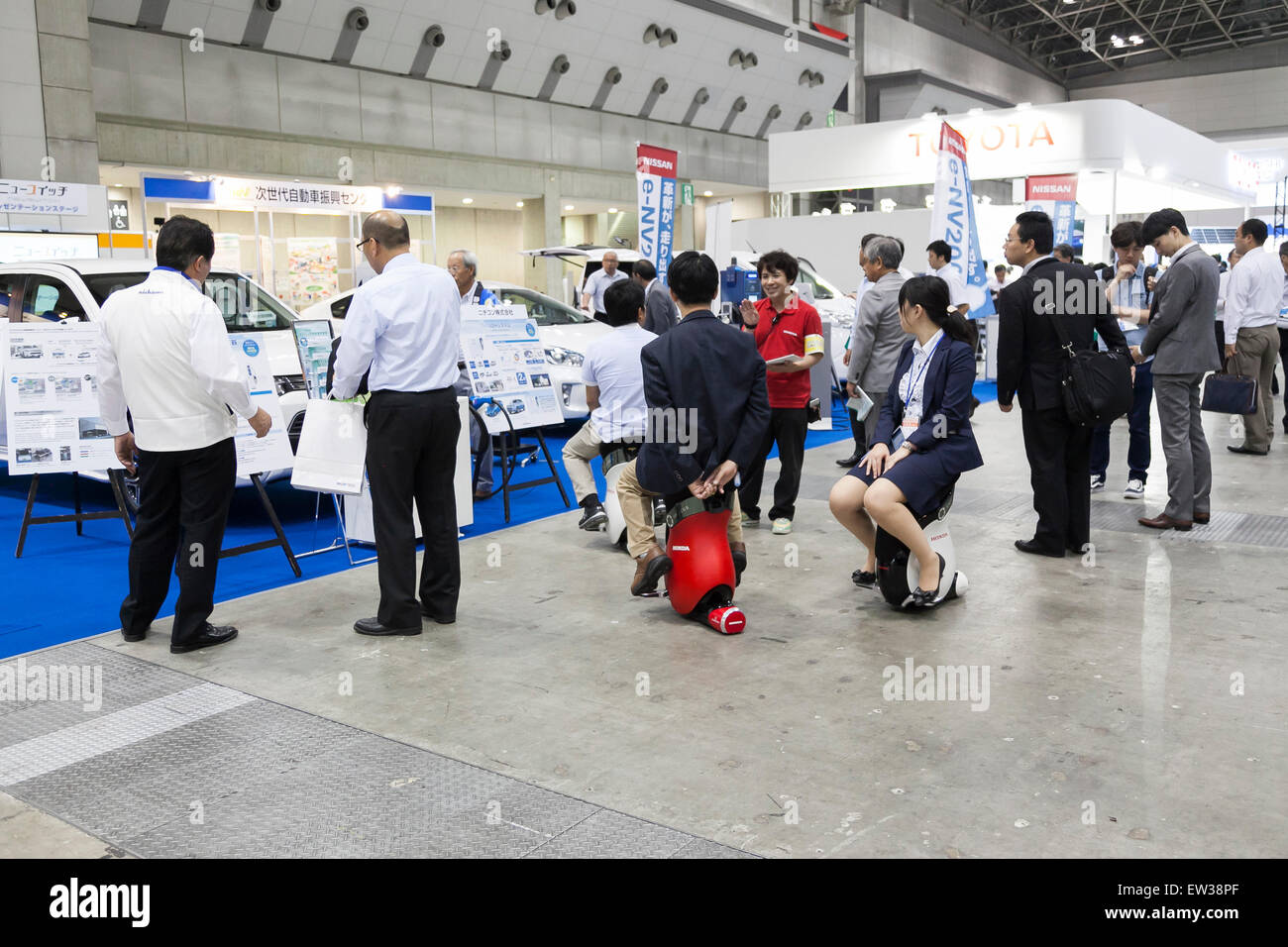 Tokyo, Japan. 17th June, 2015. Visitors drive a personal mobility device ''UNI-CUB'' at the Smart Community Japan 2015 in exhibition in Tokyo, Big Sight on June 17, 2015, Tokyo, Japan. The exhibition promotes both domestic and overseas next-generation technologies. The last year 39,879 visitors attend the expo during three days. This year 233 enterprises and organizations will show their products from June 17th to 19th. Credit:  Rodrigo Reyes Marin/AFLO/Alamy Live News Stock Photo