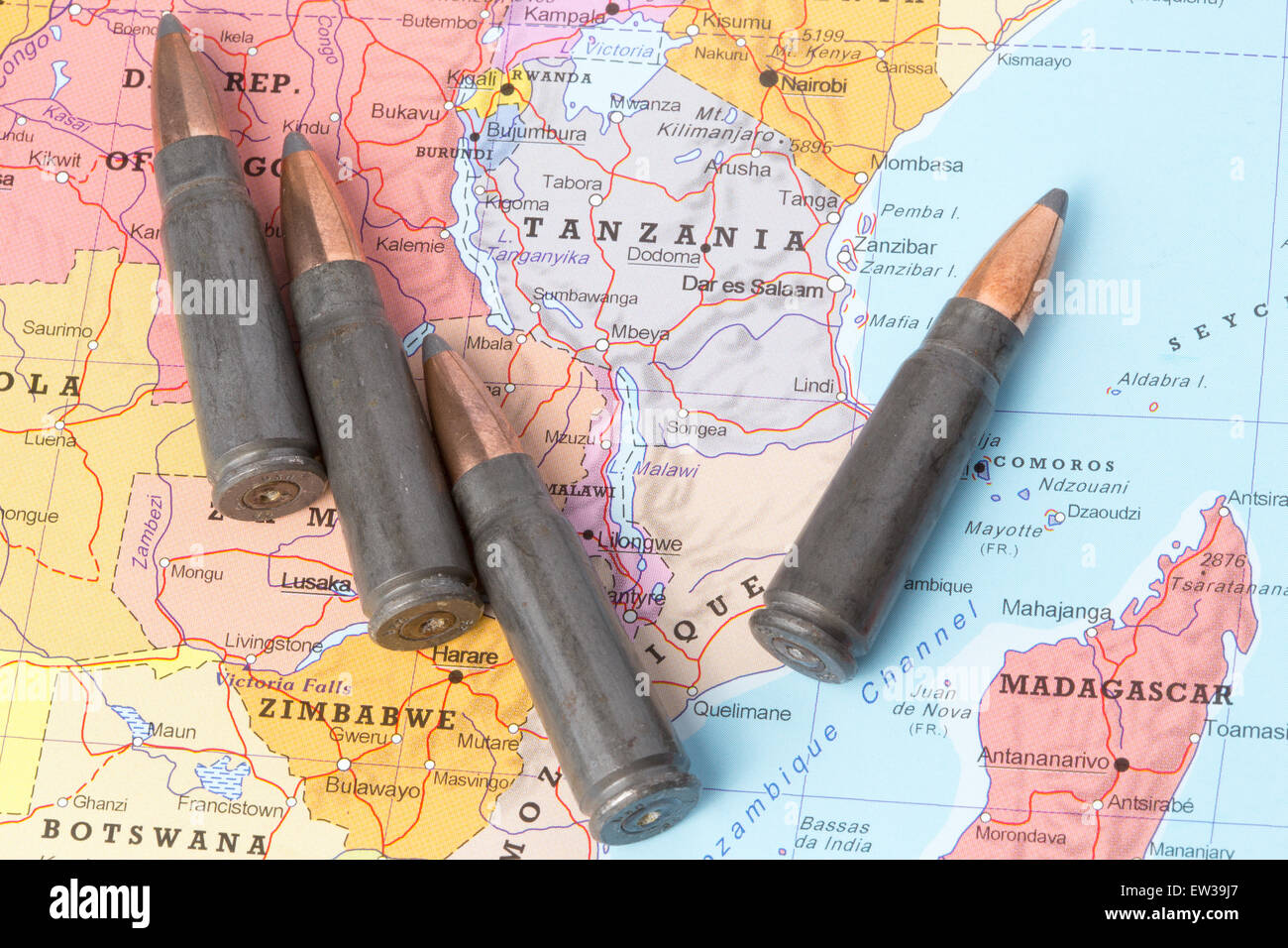 Four bullets on the geographical map of Tanzania. Conceptual image for war, conflict, violence. Stock Photo