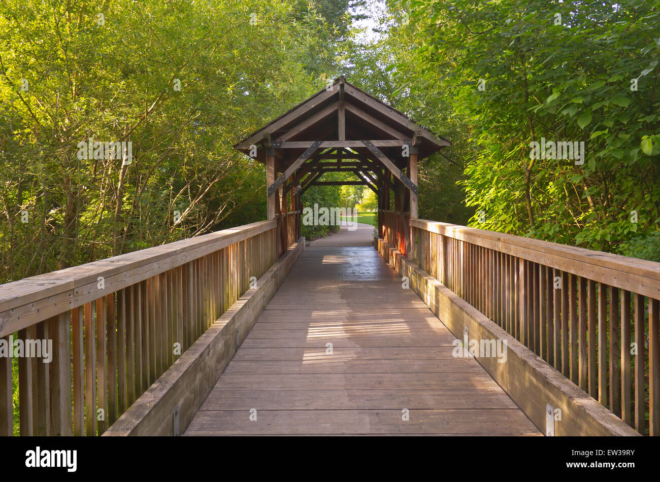 Small wooden covered bridge in Fairview Village Oregon Stock Photo Alamy