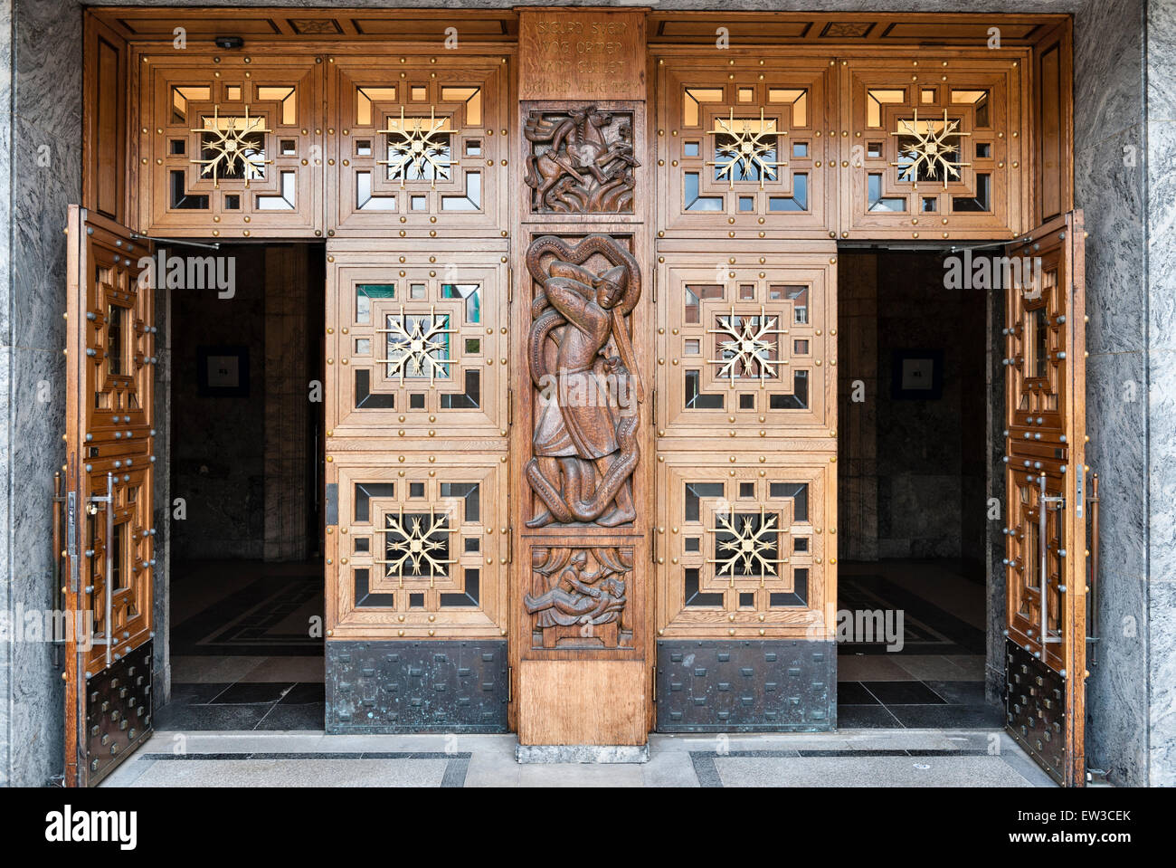 The City Hall (Radhus), Oslo, Norway. Elaborate carving on the doors into the Grand Hall (Radhushallen) Stock Photo