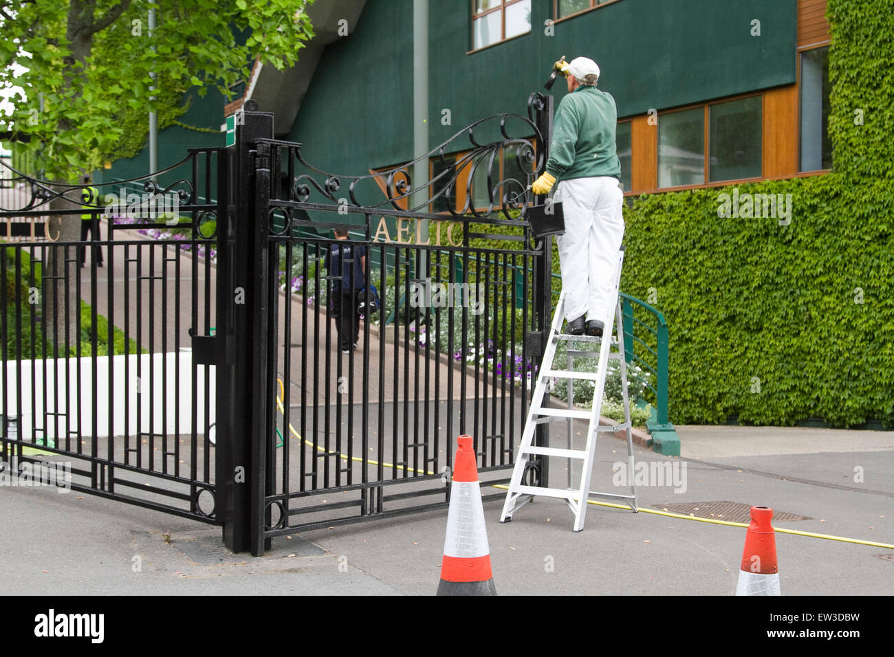 Wimbledon London,UK. 17th June 2015. The front entrance of the AELTC is repainted by ground staff in the build up to the 2015 Wimbledon tennis championships Credit:  amer ghazzal/Alamy Live News Stock Photo