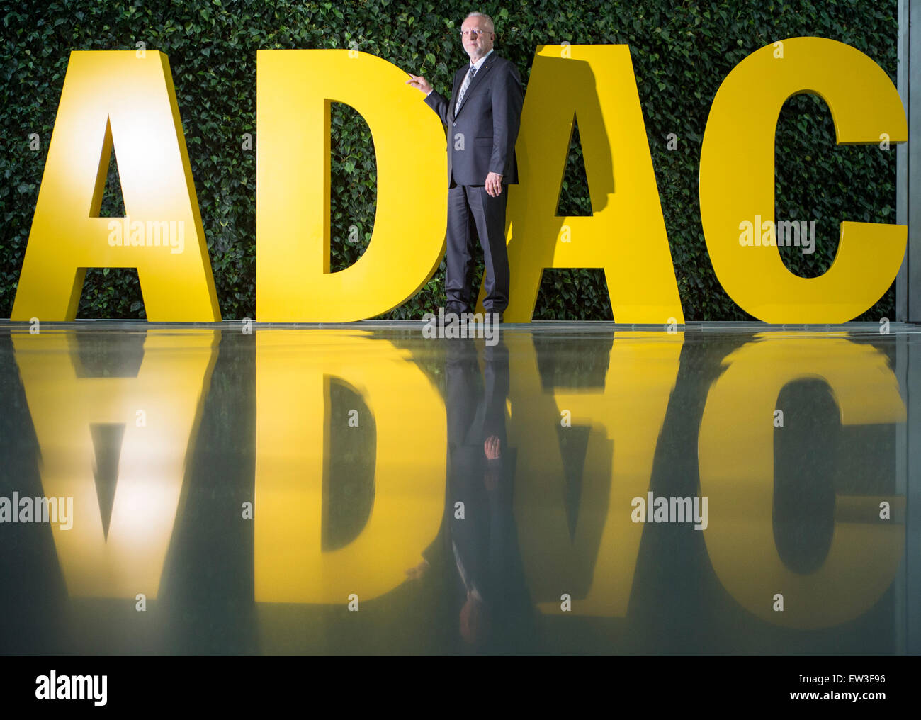 Munich, Germany. 17th June, 2015. President of ADAC August Markl stands in front of the logo of ADAC, which is reflected in the stone floor of the reception area of the automobile club's headquarters, after the annual press conference in Munich, Germany, 17 June 2015. The automobile club is presenting the outcomes of its subsidiaries. Photo: PETER KNEFFEL/dpa/Alamy Live News Stock Photo