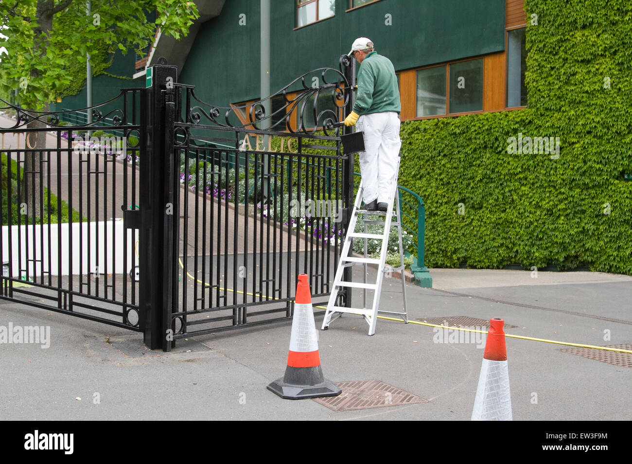 Wimbledon London,UK. 17th June 2015. The front entrance of the AELTC is repainted by ground staff in the build up to the 2015 Wimbledon tennis championships Credit:  amer ghazzal/Alamy Live News Stock Photo