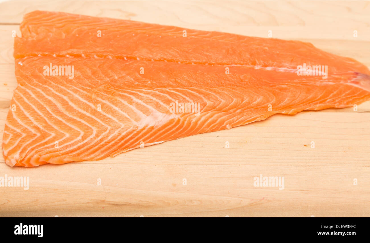 Fresh, raw piece of atlantic salmon on a wood cutting board Stock Photo ...