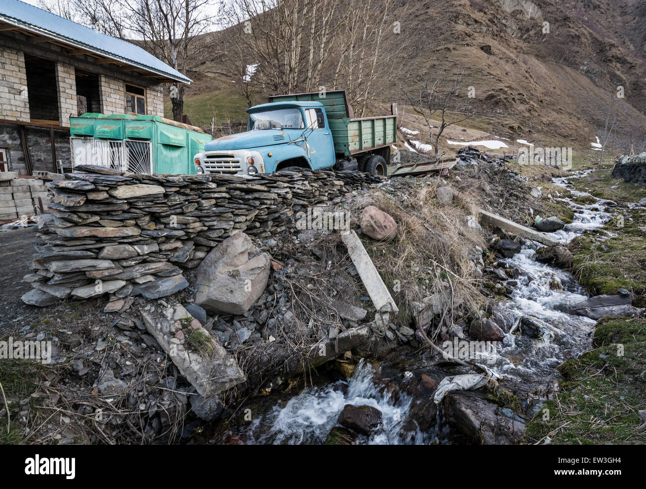 Old ZIL-133 truck in Gergeti village near Stepantsminda town Kazbegi) in Caucasus Mountains in Mtskheta-Mtianeti region, Georgia Stock Photo