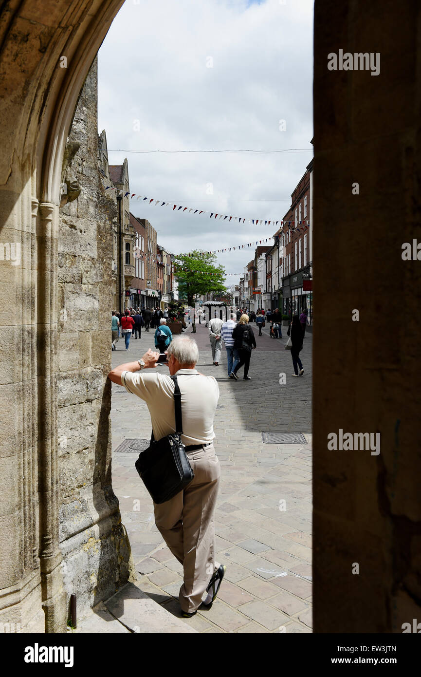 Shoppers in East Street Chichester viewed form the Market Cross West Sussex England UK Stock Photo