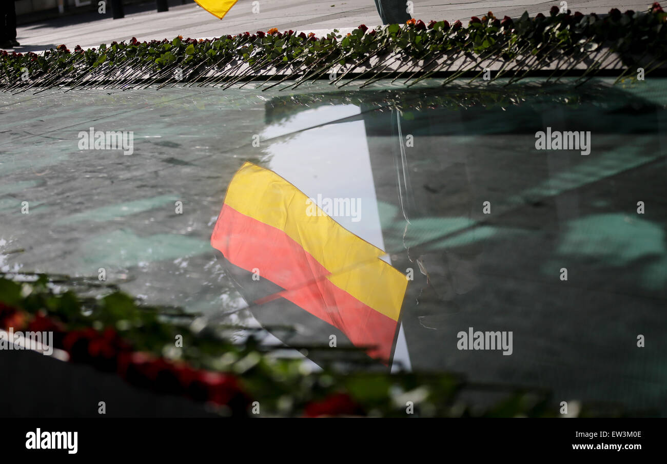 Berlin, Germany. 17th June, 2015. A flag is reflected in the surface of the memorial in front of the Finance Ministry at the site of the people's revolt in Berlin, Germany, 17 June 2015. 62 years ago over one million people took to the streets in around 700 GDR locations. The revolt was defeated with tanks from the Soviet occupying forces. Photo: KAY NIETFELD/dpa/Alamy Live News Stock Photo