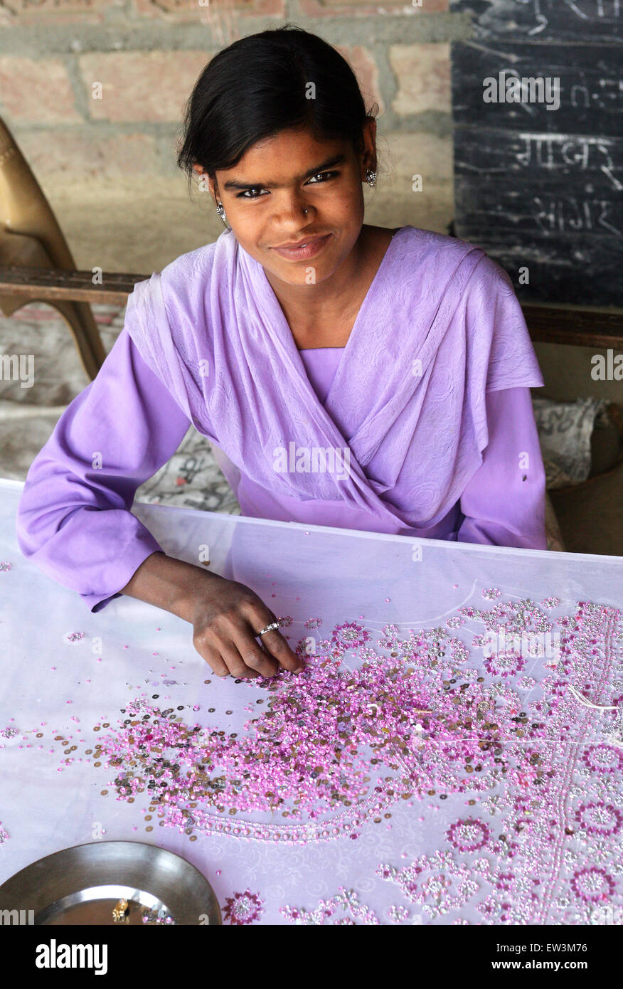 Young woman with embroidery in a village of Rampur region, Uttar Pradesh, India Stock Photo