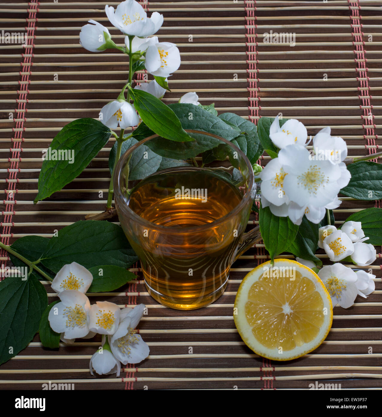 the tea decorated with branches of the blossoming bush Stock Photo