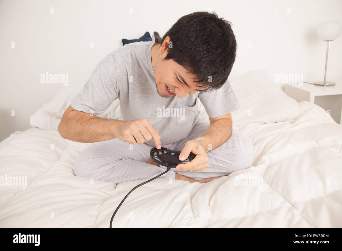 Young man in his bedroom Stock Photo