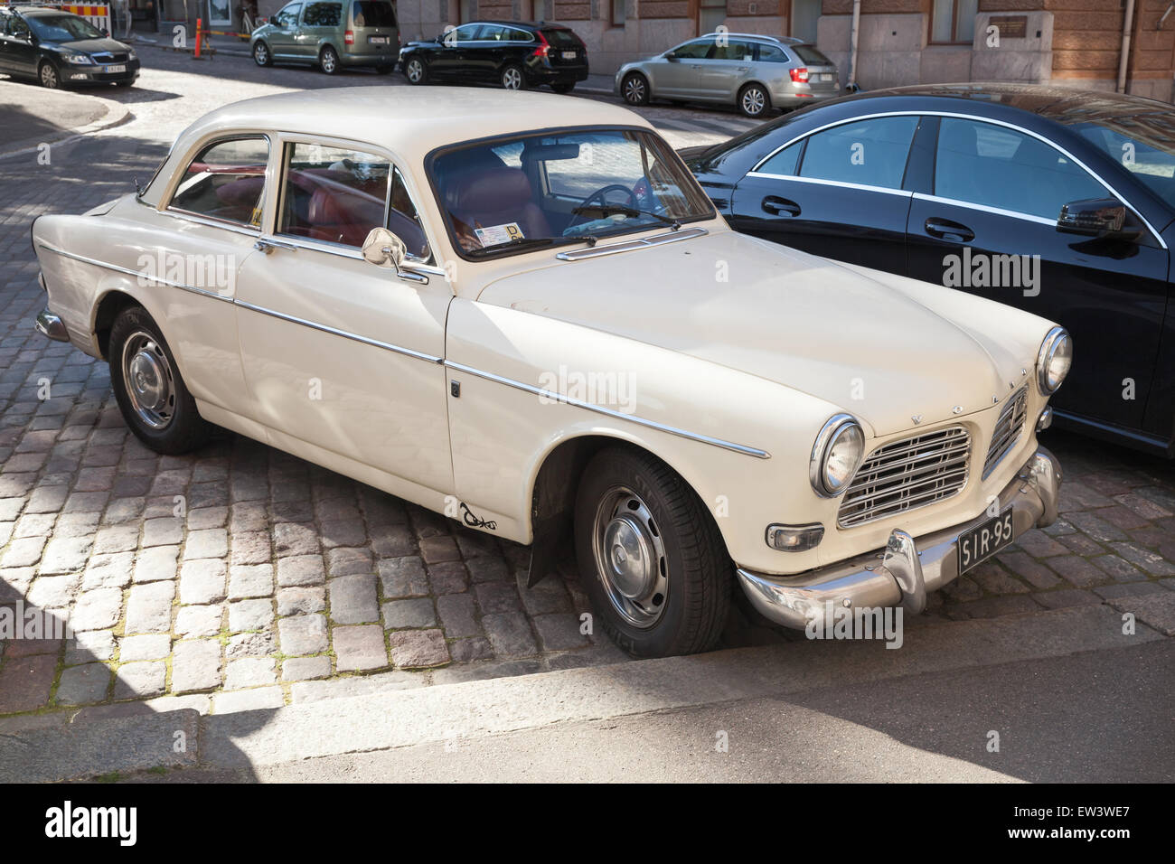 Helsinki, Finland - June 13, 2015: Old white Volvo Amazon 121 B12 car is parked on the roadside in Helsinki Stock Photo