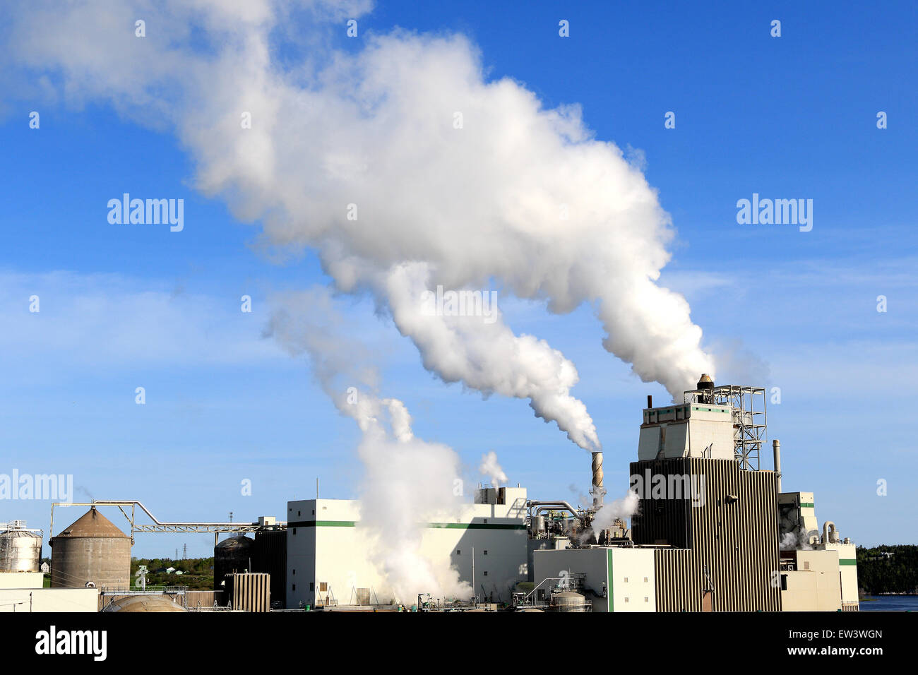 Smoke from factory releases air pollution and greenhouse gases. Stock Photo