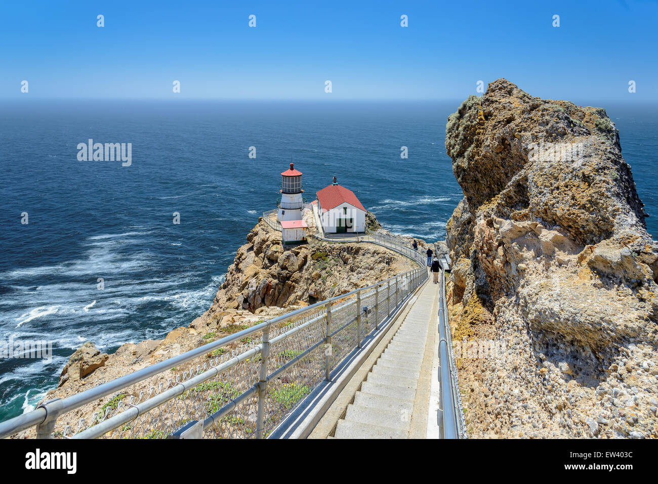 Ladder down to the sea and lighthouse on the rock.  Point Reyes Lighthouse, California, USA Stock Photo