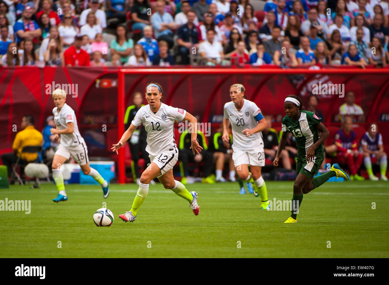 Vancouver, Canada. 16th June, 2015. United States midfielder Lauren Holiday (#12) with the ball during the opening round match between Nigeria and the United States at the FIFA Women's World Cup Canada 2015 at BC Place Stadium. The United States won the match 1-0. Credit:  Matt Jacques/Alamy Live News Stock Photo