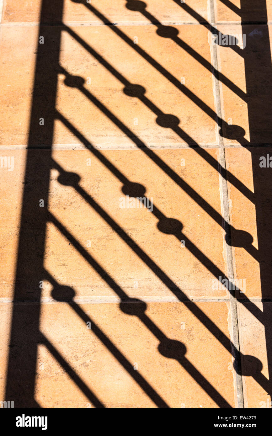 Railing shadow against the ground Stock Photo