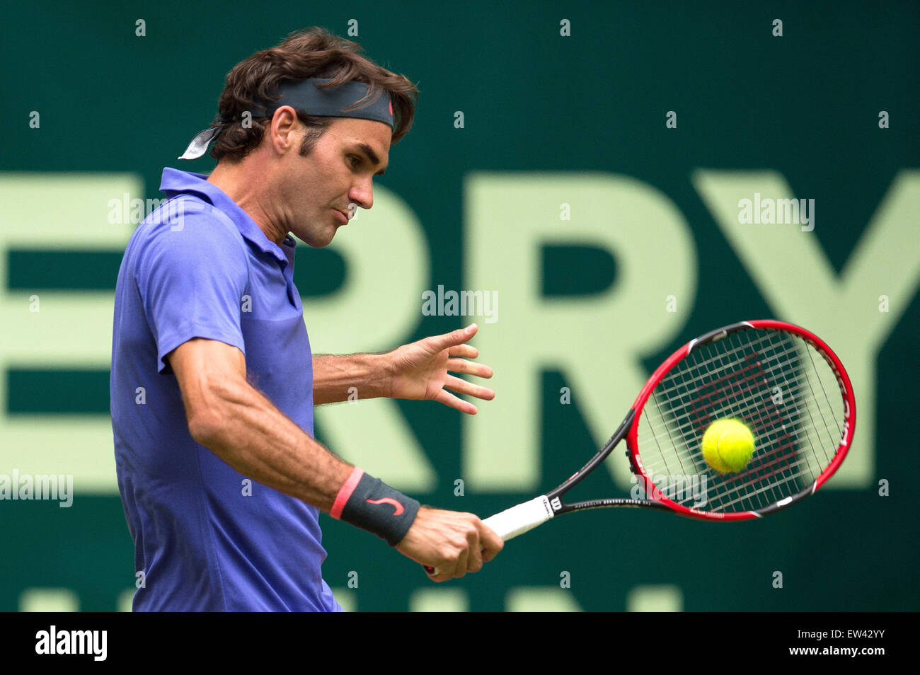 Halle, Germany. 17th June, 2015. Roger Federer of Switzerland in action during the round of 16 match against Gulbis of Latvia at the ATP tennis tournament in Halle, Germany, 17 June 2015. Photo: MAJA HITIJ/dpa/Alamy Live News Stock Photo