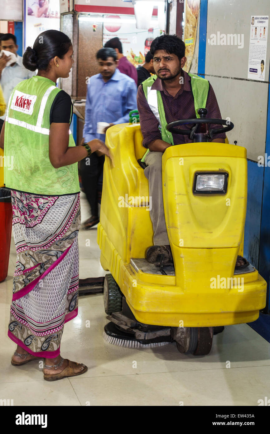 Mumbai India,Churchgate Railway Station,interior inside,sweeper,man men male,woman female women,employee worker workers working staff,India150303004 Stock Photo