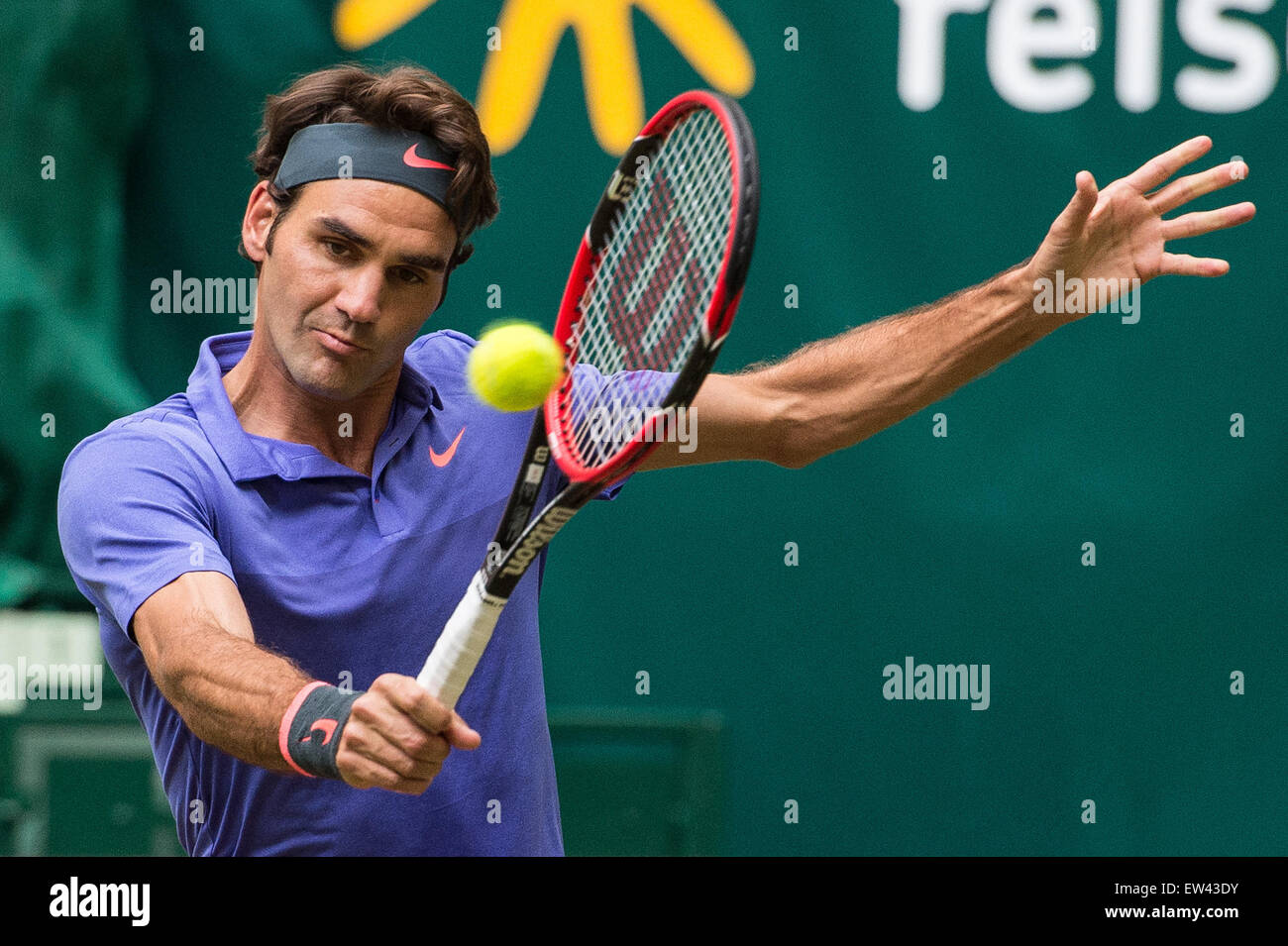 Halle, Germany. 17th June, 2015. Roger Federer of Switzerland in action during the round of 16 match against Gulbis of Latvia at the ATP tennis tournament in Halle, Germany, 17 June 2015. Photo: MAJA HITIJ/dpa/Alamy Live News Stock Photo
