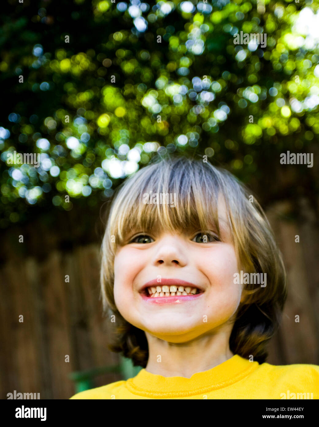 young cute boy playing in backyard Stock Photo