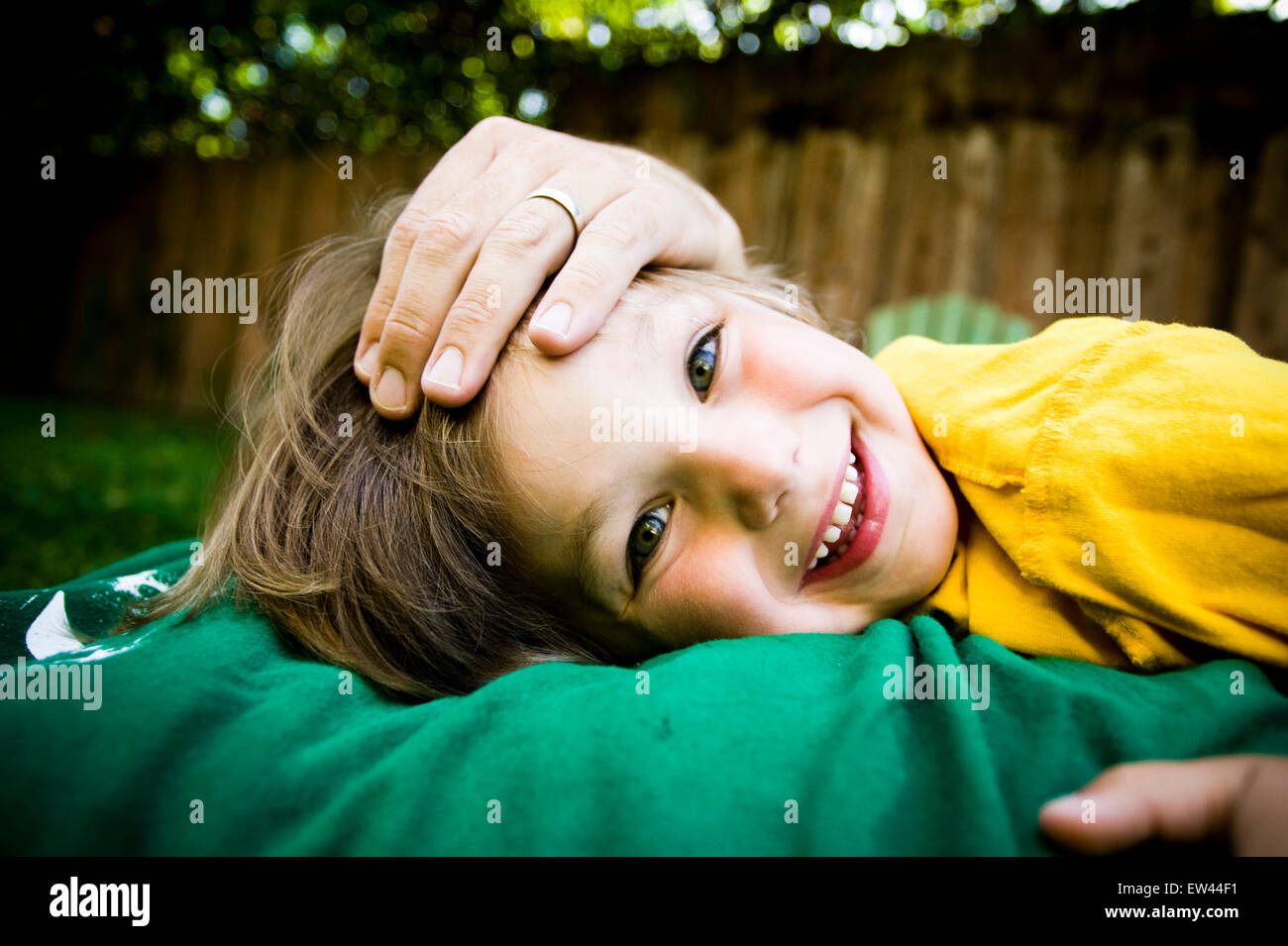 young cute boy playing in backyard Stock Photo