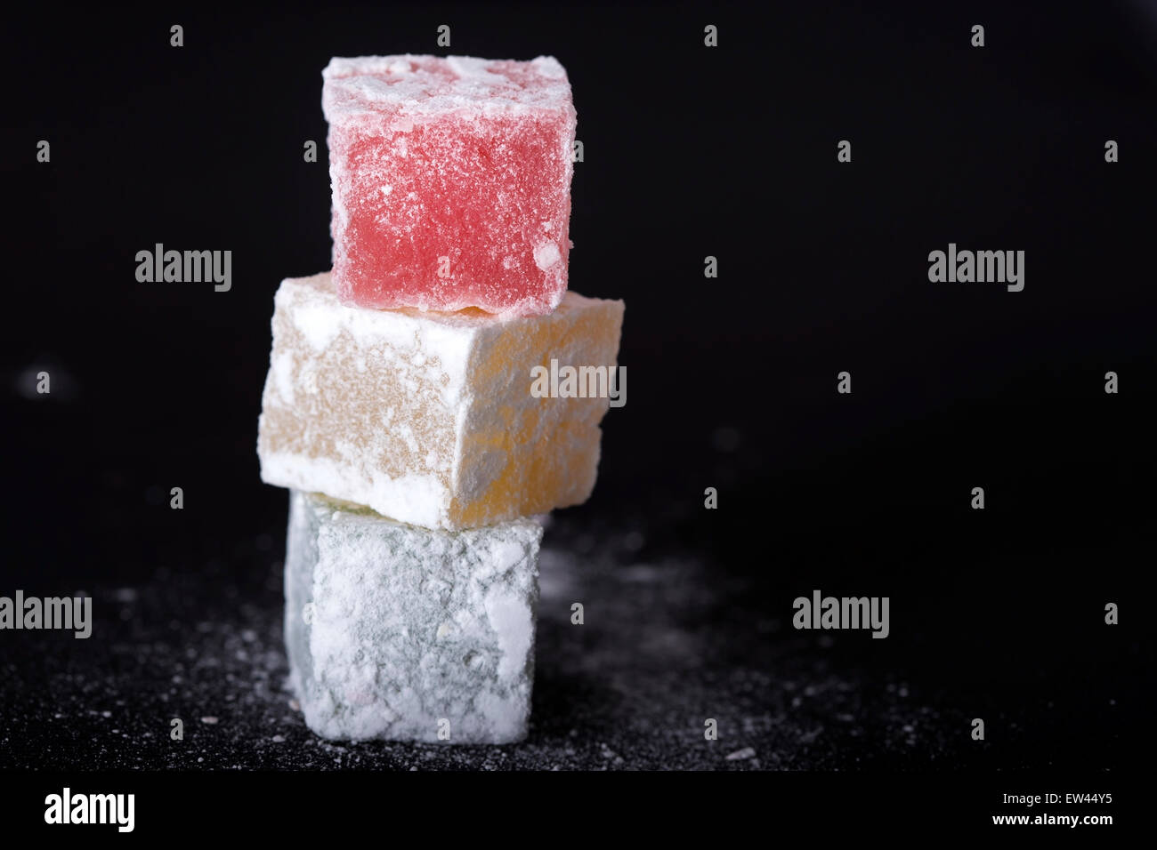 Turkish delight pieces over black background Stock Photo
