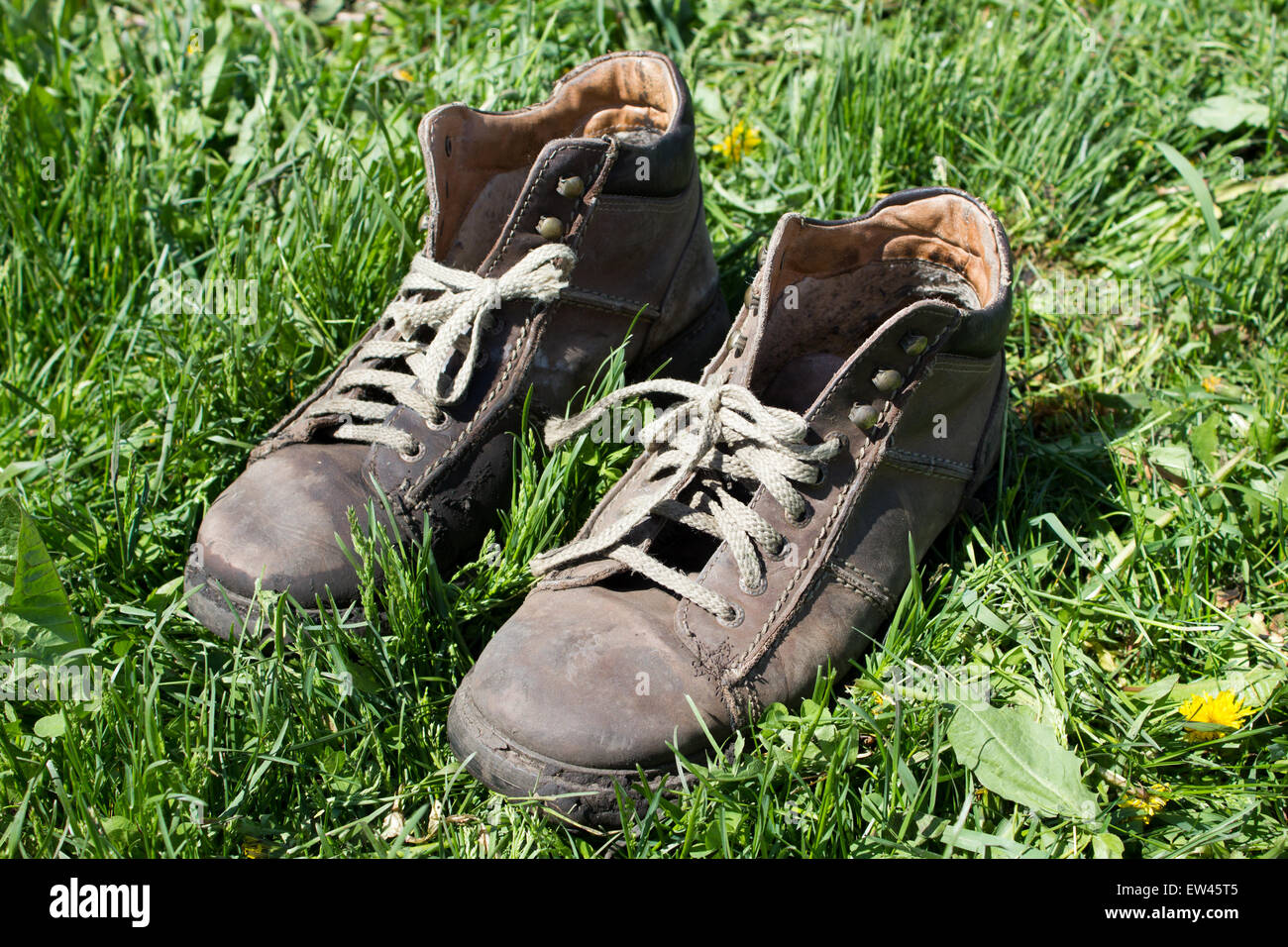 Boots on grass background/A vintage boots on grass Stock Photo - Alamy