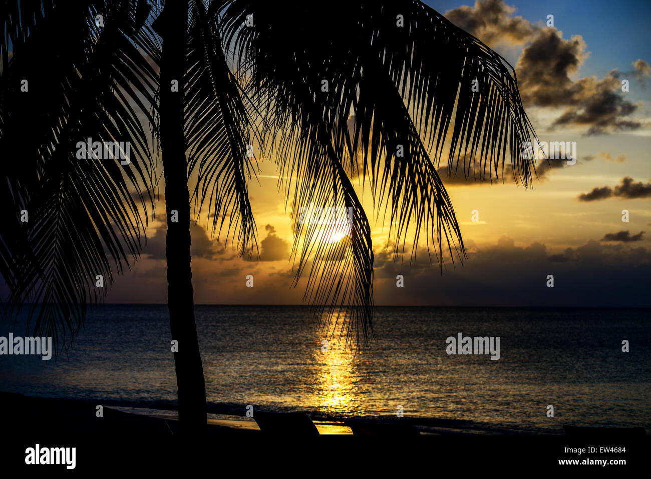 A golden sunset over the Caribbean sea viewed from St. Croix, U. S. Virgin Islands. Stock Photo