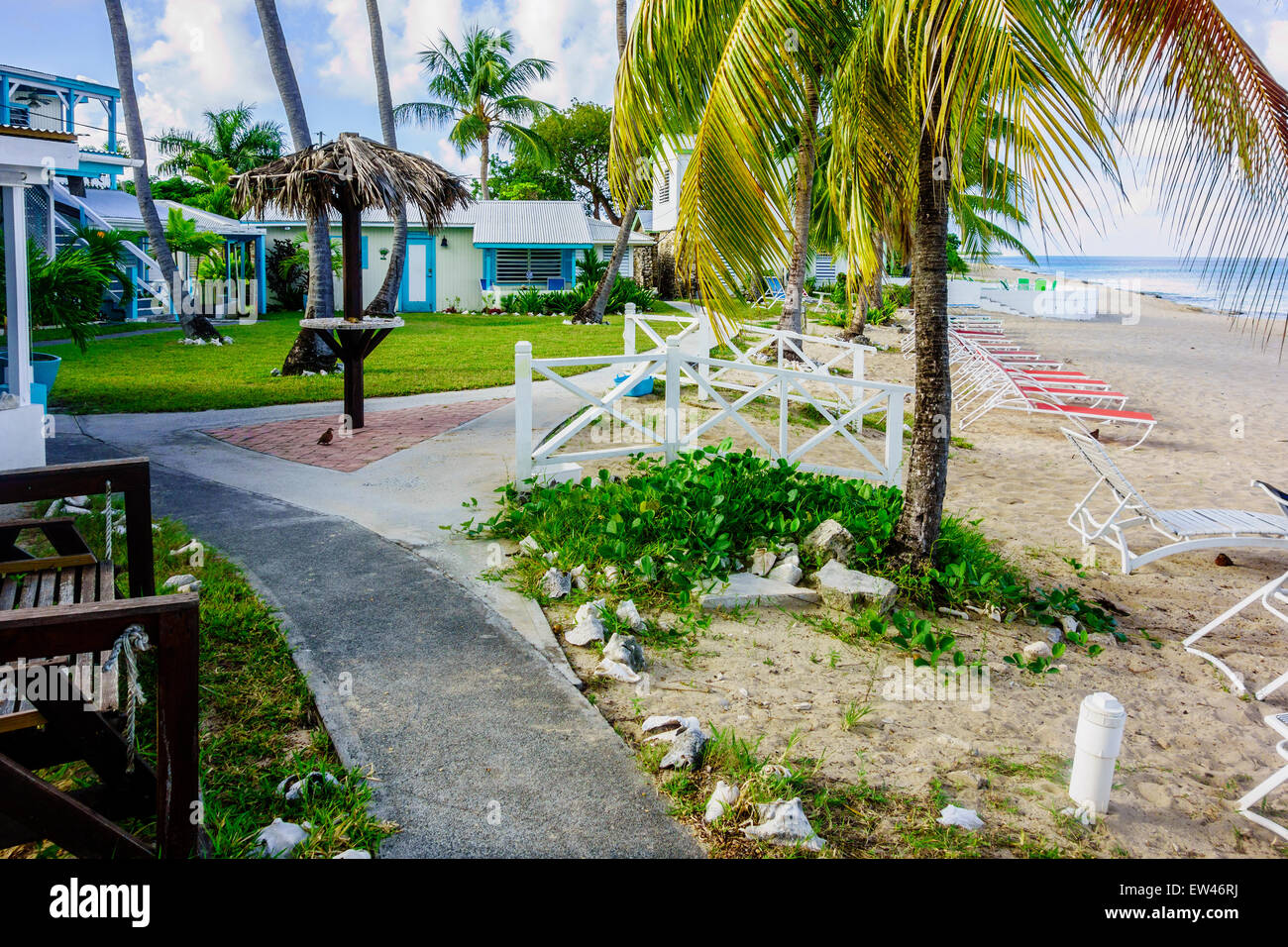 Cottages By the Sea, a resort on the west end of St. Croix, U. S. Virgin Islands. Showing cottages, a path and the beach. Stock Photo