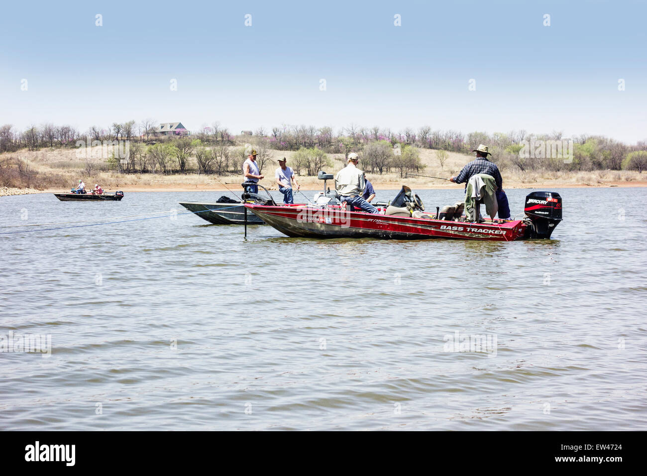 Three bass boats with men Crappie fishing in Kaw lake in Oklahoma in the spring. USA. Stock Photo