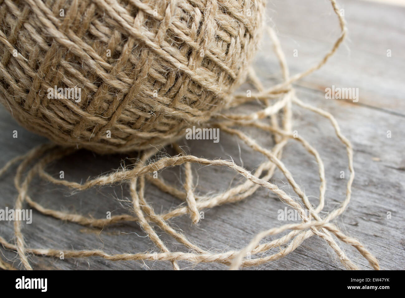 wool ball of threads on wooden table Stock Photo