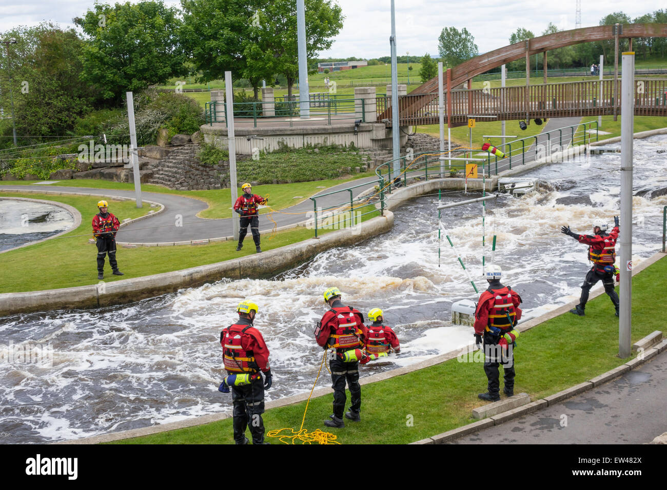 Firefighters at Tees Barrage White Water course  , practicing the use of a throwing line to rescue someone from the water. Stock Photo