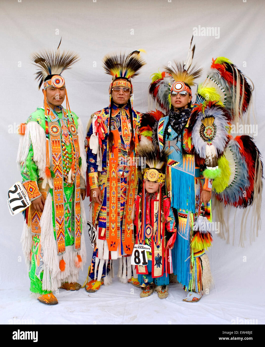 Portrait of a Native American family in traditional dress at a powwow ...