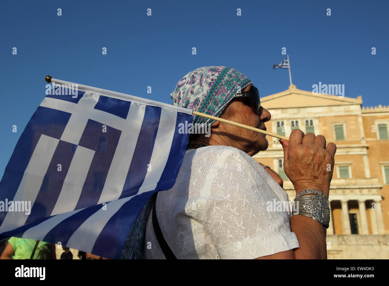 Athens. 17th June, 2015. A demonstrator takes part in a rally in front of Greek Parliament in Athens, June 17, 2015. Following a call on the social-media by the group Eurochange Express, the rally that aims at defending Greece's dignity was organized under the slogan 'We take the negotiation into our hands - We knock down austerity'. © Marios Lolos/Xinhua/Alamy Live News Stock Photo