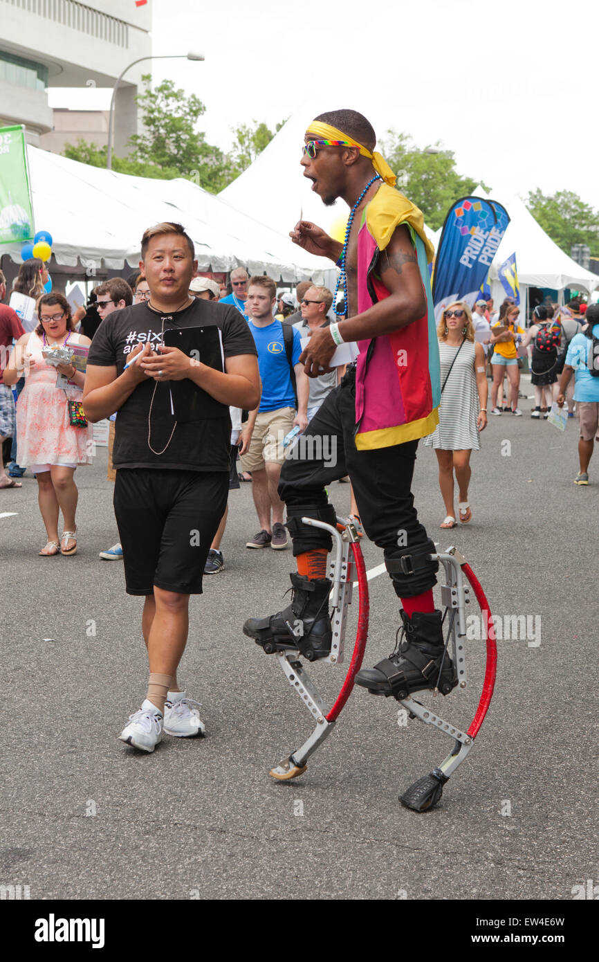 Man walking on jumping stilts USA Stock Photo Alamy