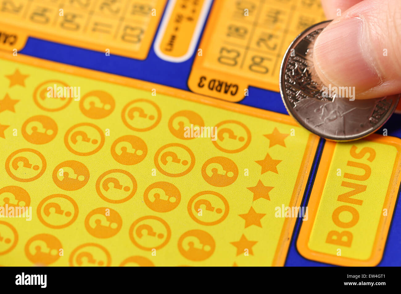 Coquitlam BC Canada June 02, 2015 Woman scratching lottery ticket