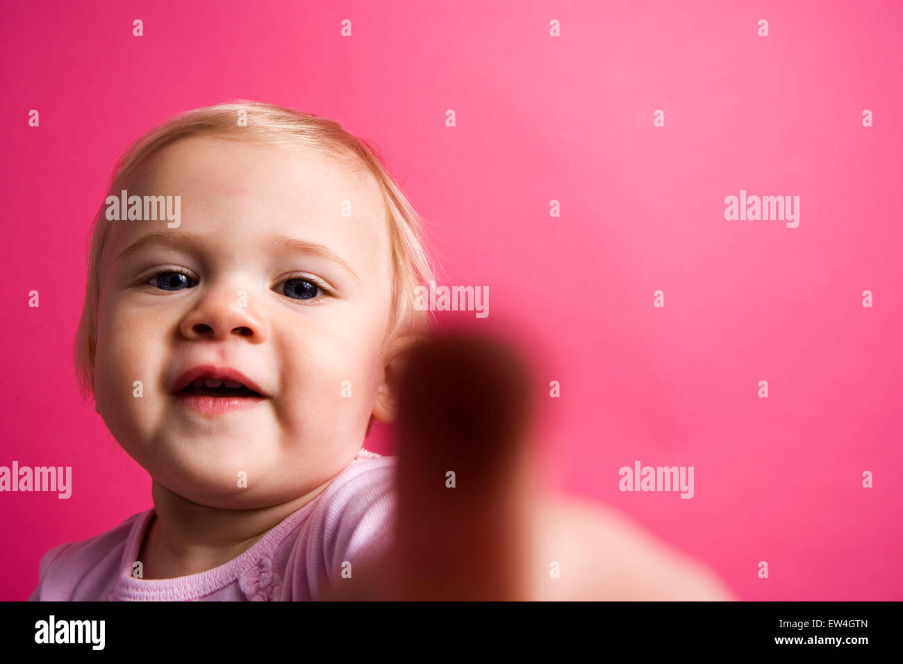 Portrait of a cute little girl trying to touch the camera Oceanside California. Stock Photo