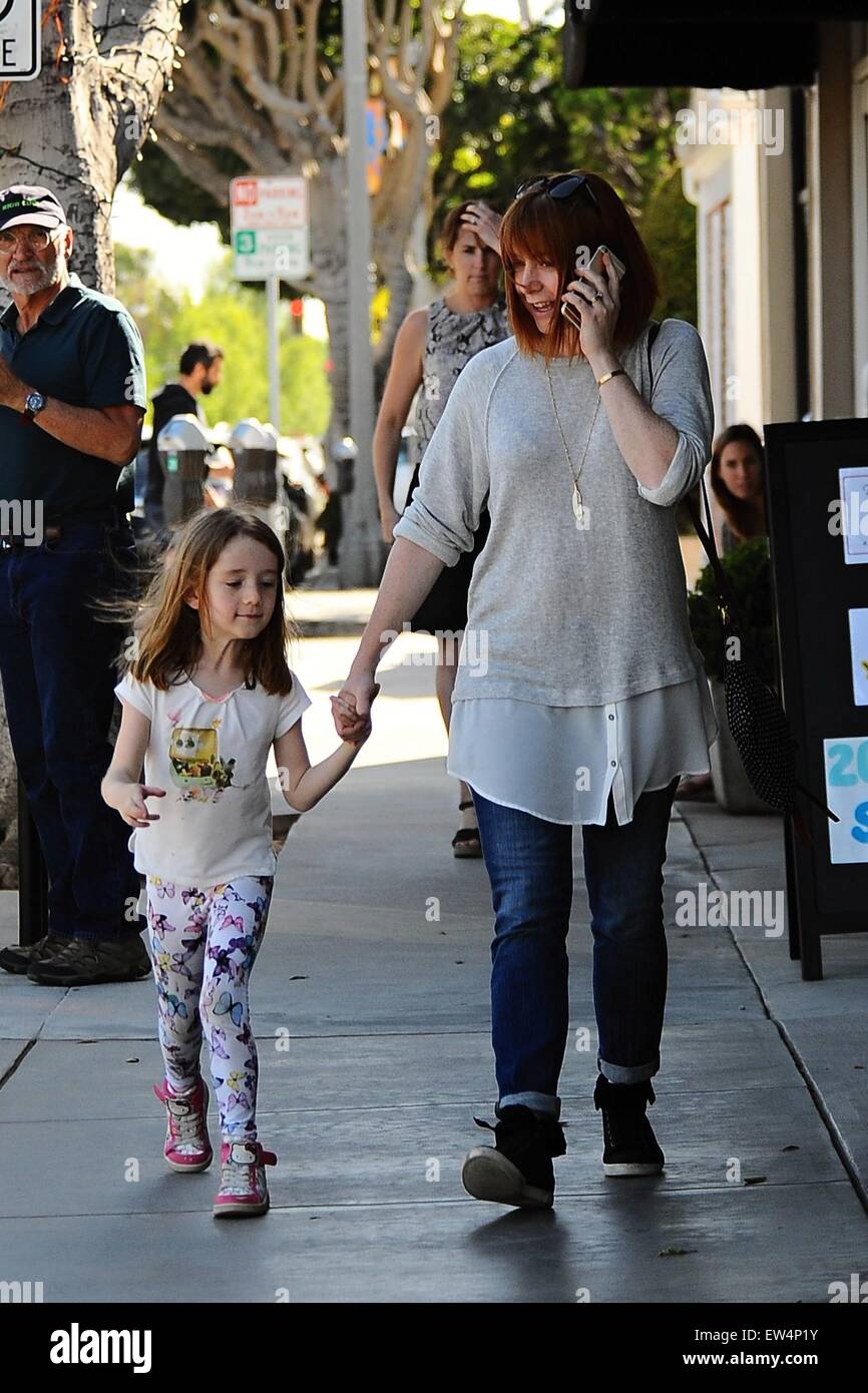 Alyson Hannigan holding hands with her daughter as they go shopping(02)