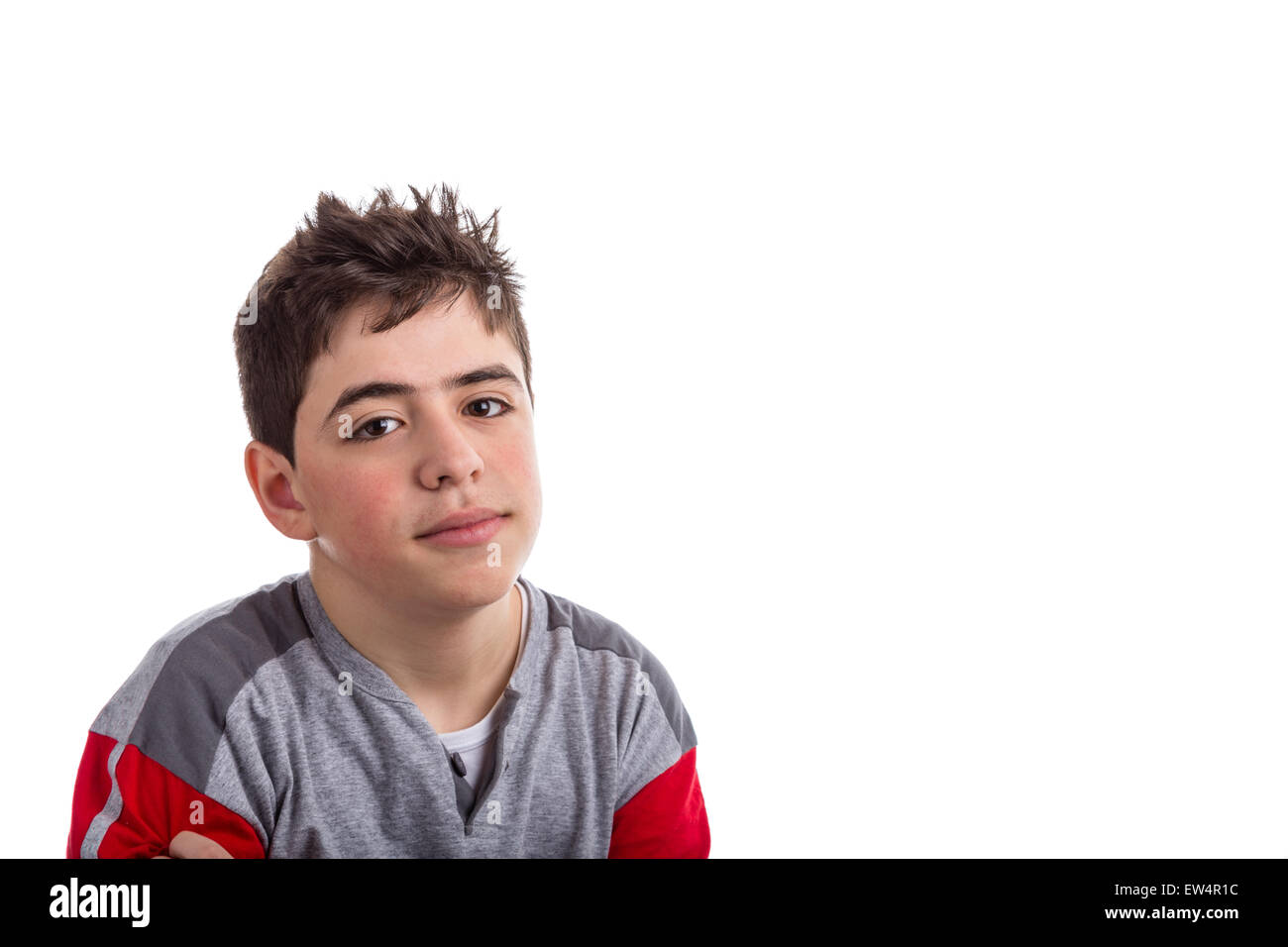 Caucasian boy in red and grey pajamas smiles reassuringly looking